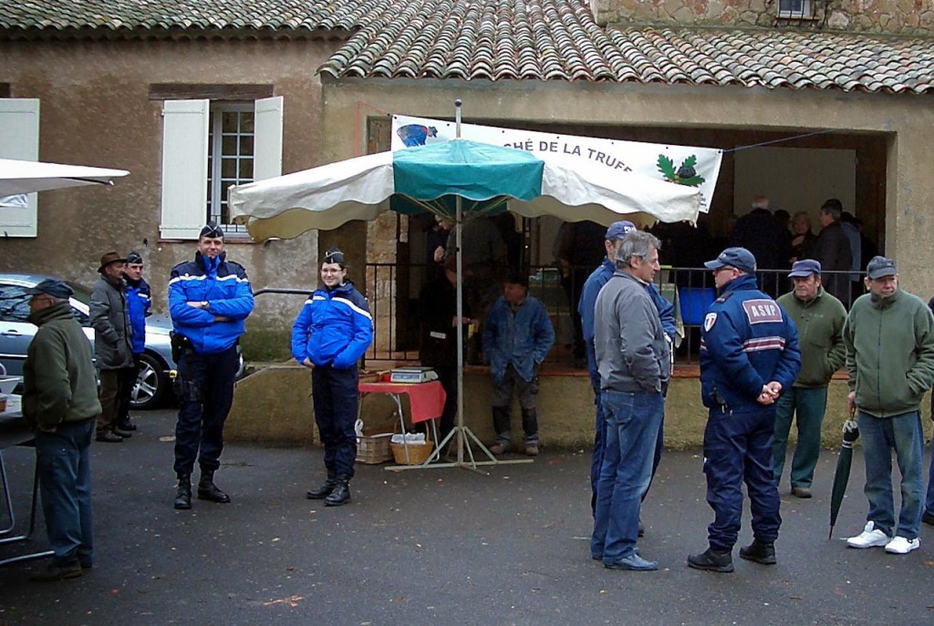 Gendarmes in the Aups Truffle Market. Photo by Pamela J. O'Neill