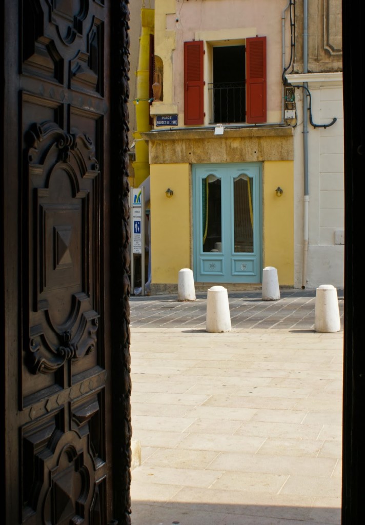 l’Eglise de Sainte Madeline: in the background (top); interior (center); view from its ornately carved door (bottom)  Photo: WT Manfull