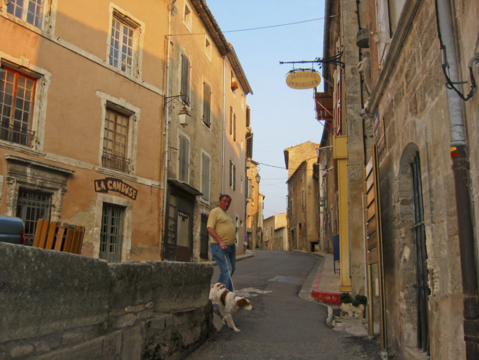 A man walking his dog in Bonnieux. Photo by W.T. Manfull